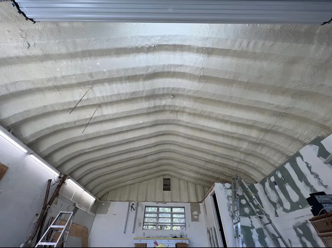 Spray polyurethane foam applied to the underside of a metal roof deck in San Clemente